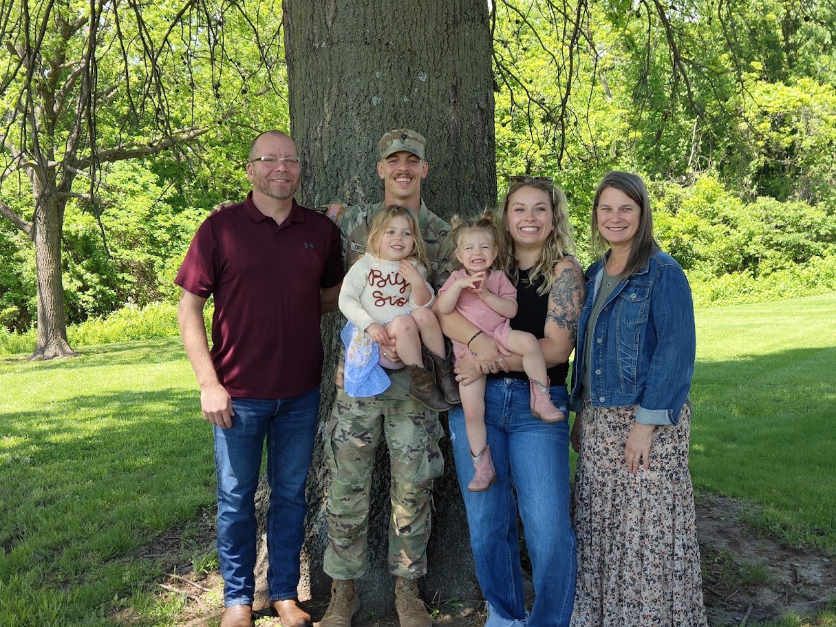 Clayton McLagan with family members gathered outdoors